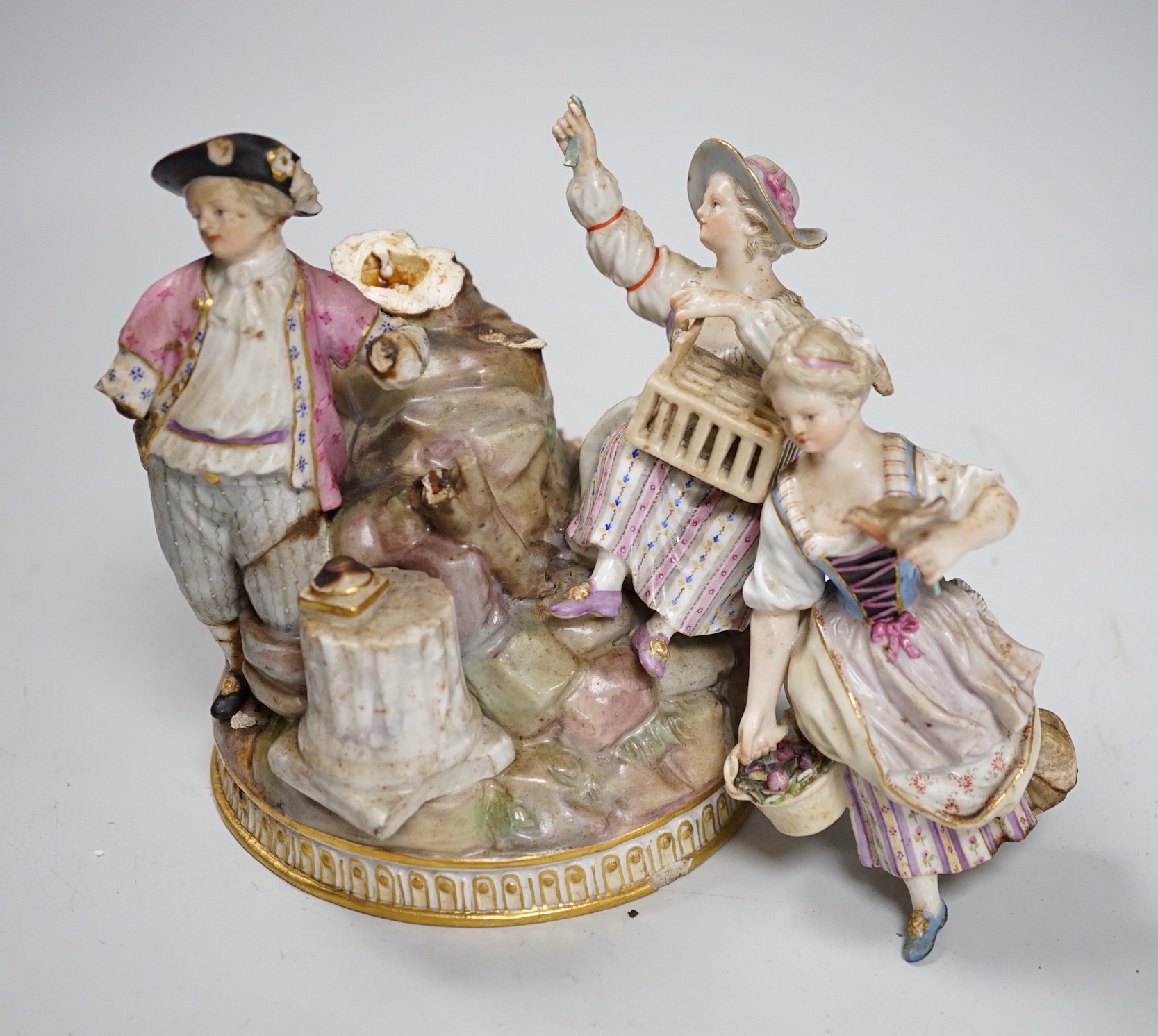 A Meissen group of flower pickers with bird cage, model F94 (a.f.)